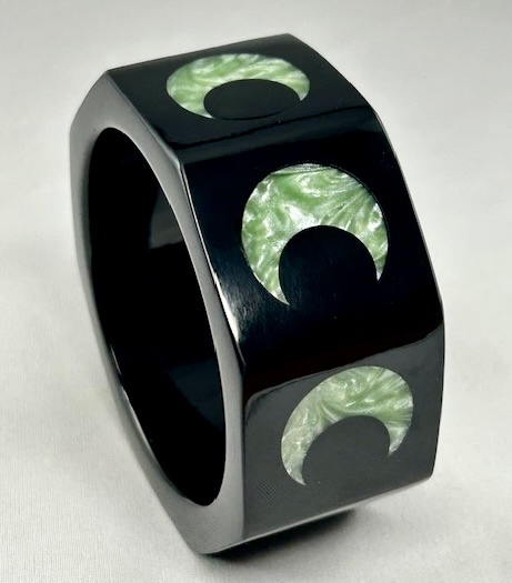 WT6 black octagon resin bangle with aqua crescent inlays